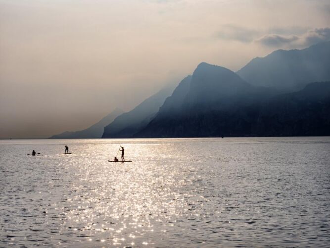 Paddle boarding scene on Lake Garda